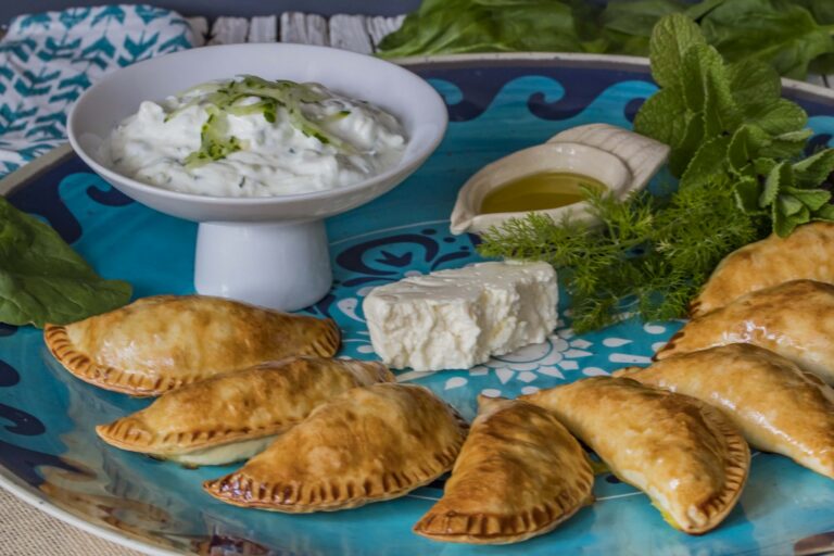 Greek spinach and feta empanadas with tzatziki Secretos Del Sur