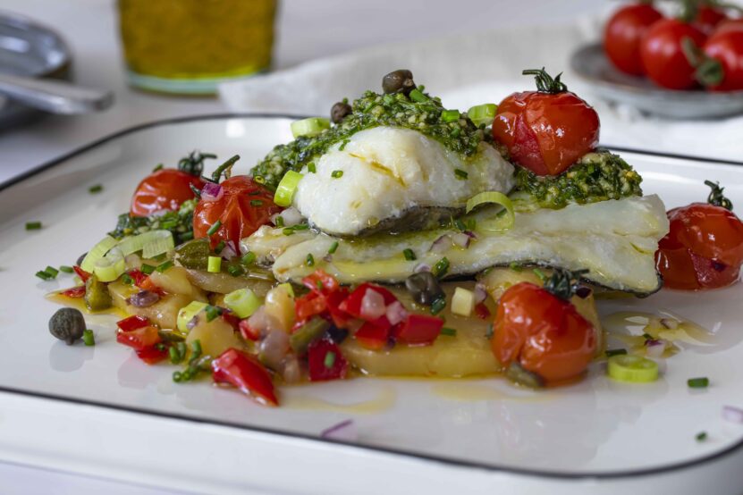 Cod with herb pesto and potato candied in oil, a surprising delicious dish