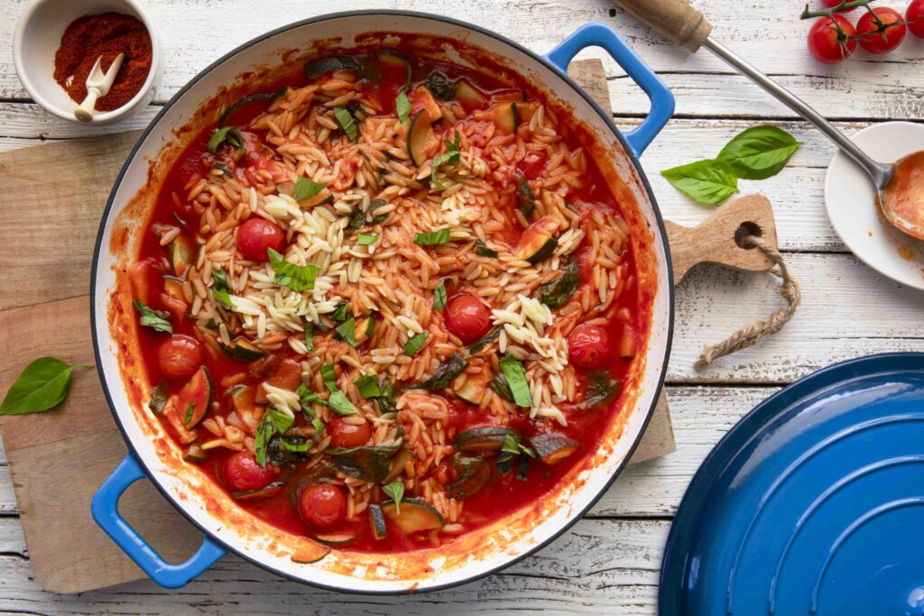 Orzo pasta with zucchini, tomato and spinach