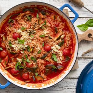 Orzo pasta with zucchini, tomato and spinach